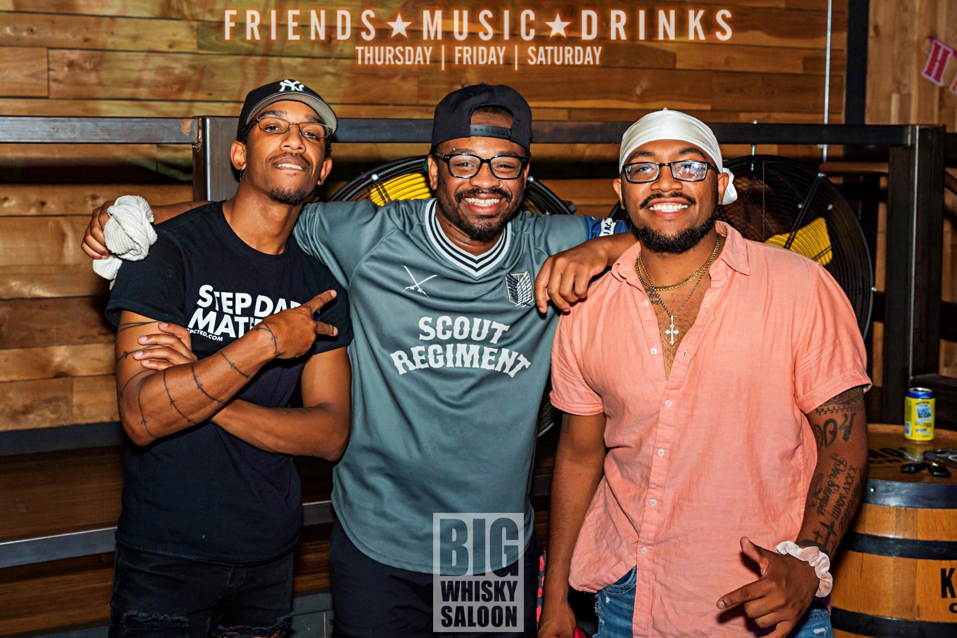 Miggy posing with two of his best buddies from the country bar.